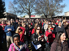 Large crowd of people attending press conference.