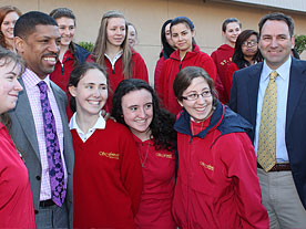 Major Johnson (l) and Brad Price (r), President of Valley Solar, with students of St. Francis High School.